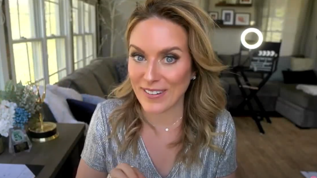 Kerry Barrett in her studio, smiling at the camera.