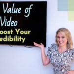 Kerry Barrett pointing at a television screen and smiling. Word read: The Value of Video to Boost Your Credibility
